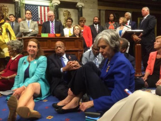 A photo shot and tweeted from the floor of the U.S. House of Representatives by U.S. House Rep. Katherine Clark shows Democratic members of the House staging a sit-in on the House floor "to demand action on common sense gun legislation" on Capitol Hill in Washington, United States, June 22, 2016. REUTERS/ U.S. Rep. Katherine Clark/Handout