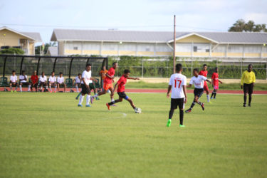 Action between Stewartville Secondary and Zeeburg Secondary at the Leonora Sports Facility in the Digicel Schools Football Championship