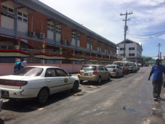 Vehicles parked outside of the Georgetown Public Hospital