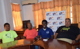 Vice President of the GRFU, Joshua Griffith (centre) makes a point  during yesterday’s press briefing. Griffith is surrounded by Coach of the U-19 team, Troy Yhip (right) and coach of the senior team, Laurie Adonis (second from left). 