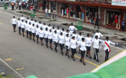 Members of the City Constabulary in their ceremonial dress march along Regent Street yesterday prior to the arrival of the President. (Photo by Keno George)
