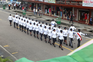 Members of the City Constabulary in their ceremonial dress march along Regent Street yesterday prior to the arrival of the President. (Photo by Keno George) 