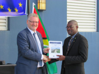 European Union Ambassador Jernej Videtič (left) hands over the Coastal Engineering Design Manual for Guyana Sea and River Defences to Minister of Public Infrastructure David Patterson. (Ministry of Public Infrastructure photo) 