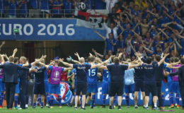 Iceland’s victorious players celebrate with their fans after the final whistle.