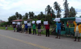Fishermen protesting at Port Mourant yesterday
