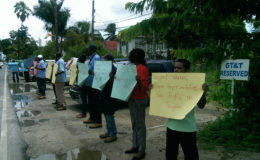 GTT workers protesting yesterday in front of its Head Office at Brickdam.