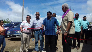 Minister of Agriculture Noel Holder (right) and Region Six Chairman David Armogan (right) among other officials as the mini ramp was commissioned at Number 66 Village. 
