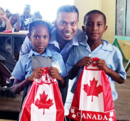 Devindra Singh with two of the pupils