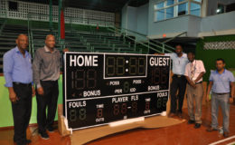 Members of the Local Organizing Committee (LOC) for the CBC U16 Championships George Vyphius (left), GABF Head, Nigel Hinds, Director of Sports, Christopher Jones and Japarts’ Terry Singh display the new Shot Clock that will be installed at the Cliff Anderson Sports Hall.