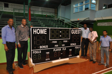  Members of the Local Organizing Committee (LOC) for the CBC U16 Championships George Vyphius (left), GABF Head, Nigel Hinds, Director of Sports, Christopher Jones and Japarts’ Terry Singh display the new Shot Clock that will be installed at the Cliff Anderson Sports Hall.