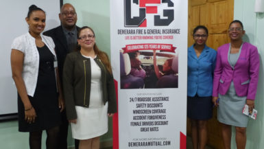 Clarence Perry (second from left) and Melissa De Santos (third from left) with other staff at the launching 