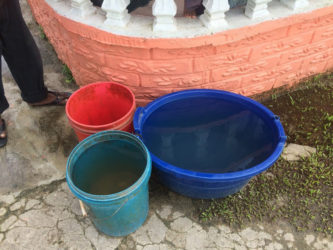 Water caught by rain inside a resident’s yard 