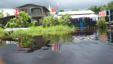 A house at Pine Ground, Mahaicony creek under flood water 