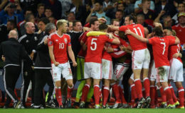 The Wales players celebrate their upset quarter-final win.