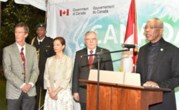President David Granger addressing the attendees at the ‘Canada Day’ reception, which was held, on Friday evening, at the High Commissioner’s residence. High Commissioner Pierre Giroux and his wife Blanca are next to him. (Ministry of the Presidency photo)
 

