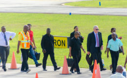 St Lucia Prime Minister Allen Chastanet (second from right) and his team being welcomed by Guyana’s Minister of Foreign Affairs Carl Greenidge (right) at the Eugene F. Correia International Airport yesterday afternoon. The Prime Minister is in Guyana for the 37th Regular Meeting of the Conference of Hads of Government of the Caribbean Community which begins today.
