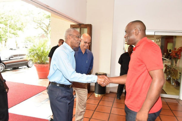 President David Granger (left)  shaking hands with Dominican Prime Minister Roosevelt Skerrit upon his arrival at the Pegasus Hotel, yesterday morning, for a breakfast meeting. (Ministry of the Presidency photo) 
