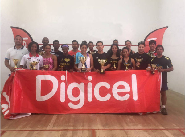 The respective division winners in the GSA sanctioned Digicel Senior Squash Championships pose with their spoils following the conclusion of the event at the Georgetown Club Facility yesterday.