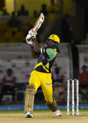 Superstar Chris Gayle hits out during his unbeaten 108 against Trinbago Knight Riders on Monday night. (Photo courtesy CPL)  