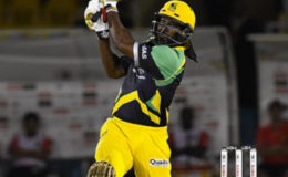 Superstar Chris Gayle hits out during his unbeaten 108 against Trinbago Knight Riders on Monday night. (Photo courtesy CPL)
