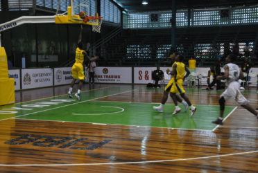Dominick Bridgewater in the process of scoring an uncontested layup during his side’s easy win over Dominica in the Caribbean Basketball Confederation (CBC) Boys u16 Championship at the Cliff Anderson Sports Hall. 