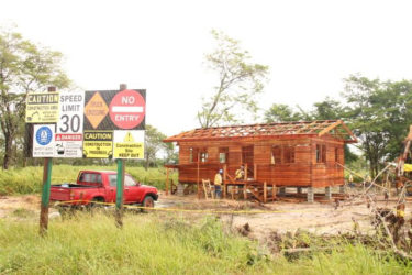 Construction work being undertaken on a wooden house for one of the relocated Timehri residents 