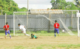 Kenbert Salvador (centre) in the process of celebrating after scoring the opening goal during their side’s lopsided win over Aishalton in the Digicel Schools Foot Championship David Coates (left) off to celebrate his second goal against Aishalton Secondary in the Digicel Schools Football Championship
