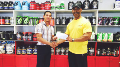GABBFF, VP, Hugh Ross (right) receiving the sponsorship cheque from Fitness Express’ CEO, Jamie McDonald on Thursday at the company’s 47 John and Sheriff Streets location. 