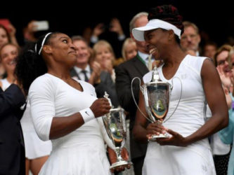 Sister ACT! Sisters Venus and Serena Williams celebrate after winning the women’s doubles title at the All England Club yesterday. (Reuters photo)