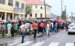 The long line of persons in front of the passport office in April.