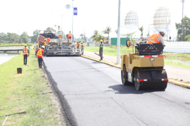 Road work crews were back on the job at Carifesta Avenue yesterday to complete the upgrading that had started in May, but was halted to allow for the Caricom Heads of Government summit held here last week. (Photo by Keno George) 