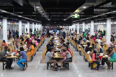 Eating Out: Visitors to the Giftland Mall at the Food Court 