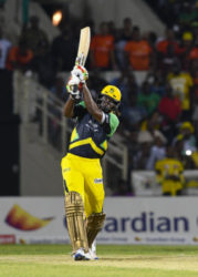 Jamaica Tallawahs captain Chris Gayle goes on the attack during his unbeaten 45 against Guyana Amazon Warriors on Friday night. (Photo courtesy CPL) 