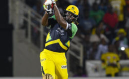Jamaica Tallawahs captain Chris Gayle goes on the attack during his unbeaten 45 against Guyana Amazon Warriors on Friday night. (Photo courtesy CPL)
