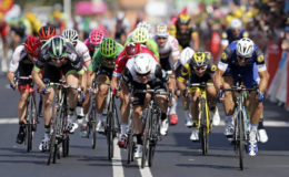 Team Dimension Data rider Mark Cavendish of Great Britain, centre, wins on the finish line. (Reuters photo)