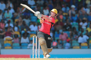 Left-hander Colin Munro strikes a boundary during his top score of 68 for Trinbago Knight Riders yesterday. (Photo courtesy CPL)