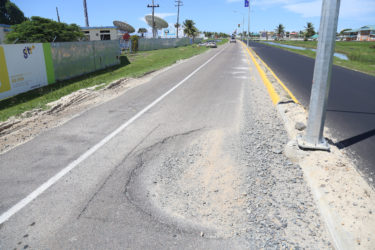 The hole located near the centre of the road on Carifesta Avenue, which the driver of PKK 8378 swerved to avoid, ending up in a trench not far away. (Photo by Keno George) 