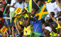 Jamaica Tallawahs fans celebrate as their side romps to victory against Trinbago Knight Riders on Monday night at Sabina Park. (Photo courtesy CPL)
