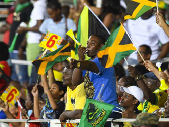 Jamaica Tallawahs fans celebrate as their side romps to victory against Trinbago Knight Riders on Monday night at Sabina Park. (Photo courtesy CPL) 