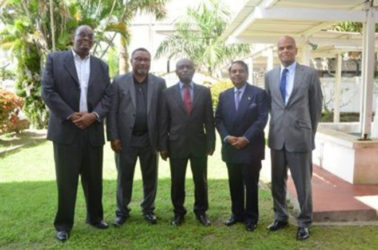 Foreign Affairs Minister Carl Greenidge (centre) flanked by some of the new heads of mission: (from left to right) Dr Kenrick Hunte, High Commissioner-designate  to South Africa; Michael Ten-Pow, Permanent Representative-designate to the UN; Dr Shamir Ally, the designated Head of Mission to Kuwait and Dr David Pollard, High Commissioner-designate  to India. (GINA photo) 