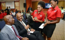 Dr Keith Rowley (left), prime minister of Trinidad and Tobago, and Professor Sir Hilary Beckles, vice chancellor of the University of the West Indies, chat with Kennika Johnson
(second right), secretary of the Guild of Students, and Sherica Taylor, public relations officer, Guild of Students.
