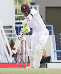 Batsman Marlon Samuels drives during his half-century against India on the fourth day of the opening Test on Sunday. (Photo courtesy WICB)  