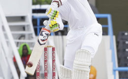 Batsman Marlon Samuels drives during his half-century against India on the fourth day of the opening Test on Sunday. (Photo courtesy WICB)
