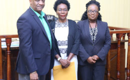 From left: Minister of State Joseph Harmon, Retired Colonel Windee Algernon and Magistrate Fabayo Azore after the swearing-in yesterday. (Photo by Keno George)