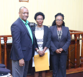 From left: Minister of State Joseph Harmon, Retired Colonel Windee Algernon and Magistrate Fabayo Azore after the swearing-in yesterday. (Photo by Keno George)