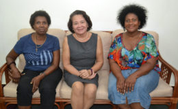 First Lady Sandra Granger (centre) is flanked by Joycelyn Thomas-Wilson (left) and Dorrie Thomas-Crawford (right) at her State House office.