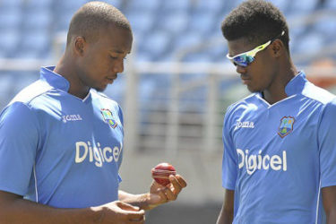 YOUNG BRIGADE: Uncapped fast bowlers Miguel Cummins (left) and Alzarri Joseph discuss plans during training. (Photo courtesy WICB)
