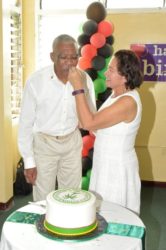 First Lady Sandra Granger was all smiles as President David Granger took the first bite of his birthday cake during his birthday celebration yesterday at Congress Place. (Ministry of the Presidency Photo) 