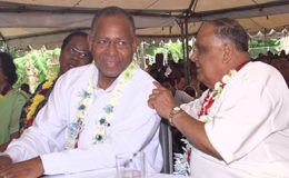 In this 2004 photograph, then prime minister Patrick Manning, has a tête-à-tête with Sanathan Dharma Maha Sabha secretary general Sat Maharaj during an Indian Arrival Day celebration in Debe.