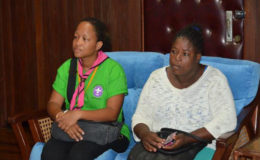 Mothers of the two injured Cub Scouts (left) Jacqueline Matthew and (right) Delia Finistere listen intently to President David Granger, during the meeting this morning. (Ministry of the Presidency photo)